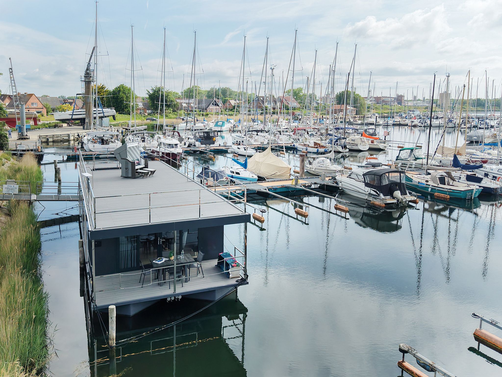 Buy custom waterfront home from European builder with roof terrace
