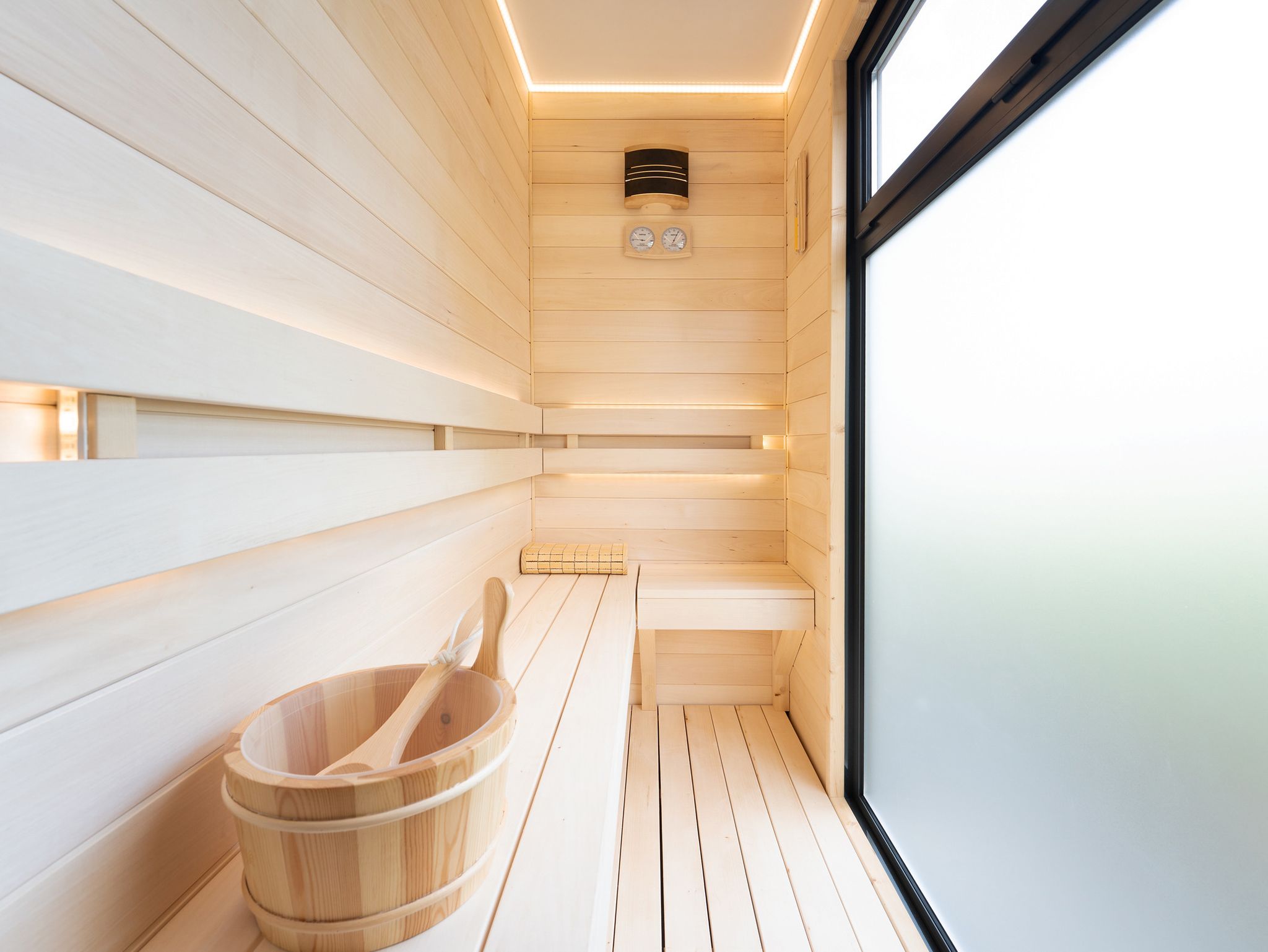 Integrated Finnish sauna inside a premium waterfront home