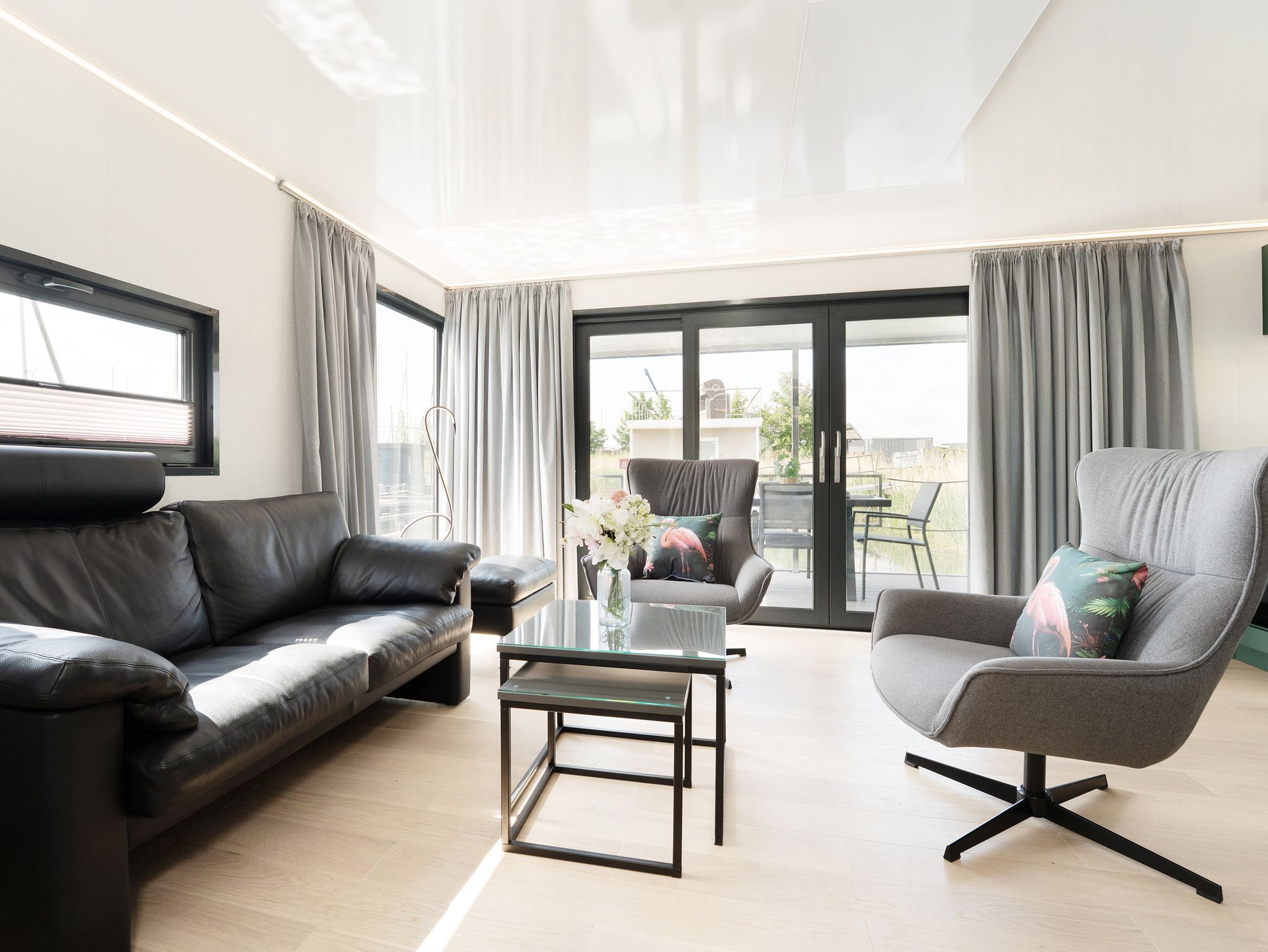 Spacious living room inside a luxury waterfront home for sale in Europe